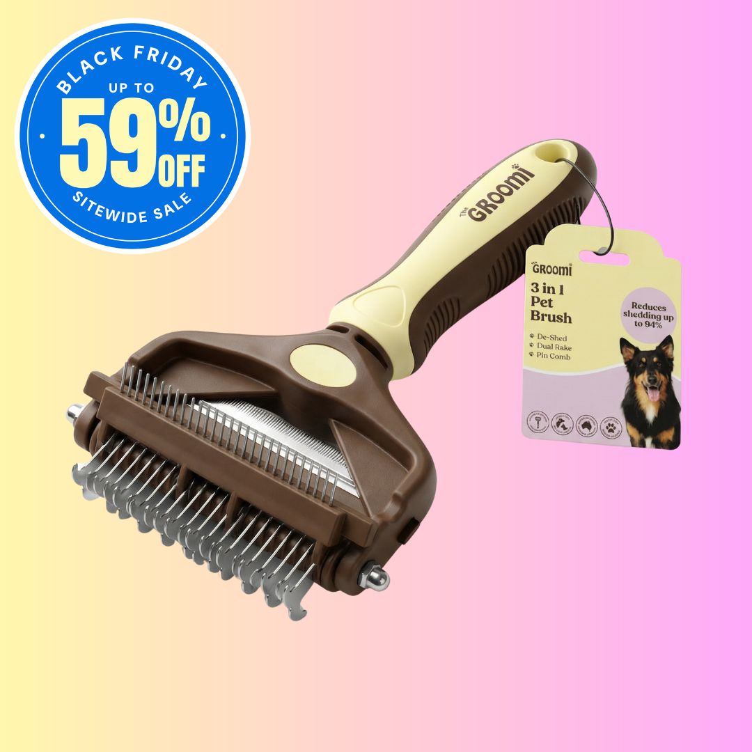 The GROOMI 3-In-1 Pet Brush, a manual dog and cat grooming brush with de-shed, dual rake and pin comb heads. It removes loose undercoat, detangles and cuts shedding on short, long, double and curly coats. Quiet, no vacuum needed, and gentle for nervous pets.