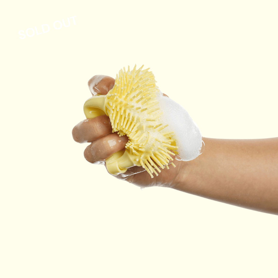 The Groomi: Foami Brush - The Ultimate Pet Bathing Brush with Built-In Foaming Dispenser. Suitable for all furry pets, cats, and dogs, the brush's soft, flexible silicone bristles promote a healthy coat. Convenient, cost-effective, and easy to use, with an ergonomic shape and non-slip hand grip design for comfortable bathing. Say goodbye to dirt and hello to clean with Foami Brush