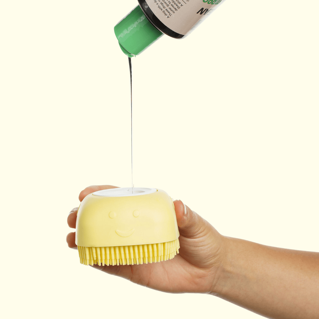 The Groomi: Foami Brush - The Ultimate Pet Bathing Brush with Built-In Foaming Dispenser. Suitable for all furry pets, cats, and dogs, the brush's soft, flexible silicone bristles promote a healthy coat. Convenient, cost-effective, and easy to use, with an ergonomic shape and non-slip hand grip design for comfortable bathing. Say goodbye to dirt and hello to clean with Foami Brush