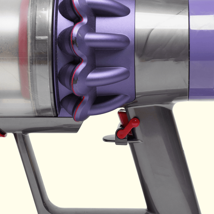 The Groomi: Groomi Trigger Lock attached to a Dyson vacuum cleaner's trigger. Effortlessly clean your home with continuous vacuuming, without holding down the trigger. The ultimate solution to your vacuuming frustrations, shipped within 48 hours with Australia Post. Secure and trusted checkout with PayPal and AfterPay. Get your Groomi Trigger Lock today Dyson V7, V8, V10, V11, V12, V15, Gen5detect, Gen5outsize, DC35, DC31, DC34, DC44, DC45, DC58, DC61, DC62, DC19, DC23, DC26, DC29, DC33,